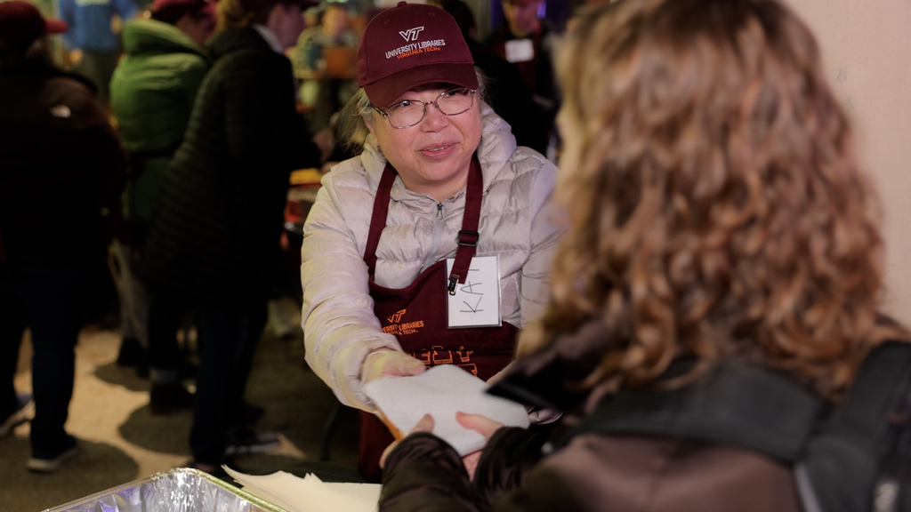 Volunteers serve up sandwiches and smiles at Cheesy Nights