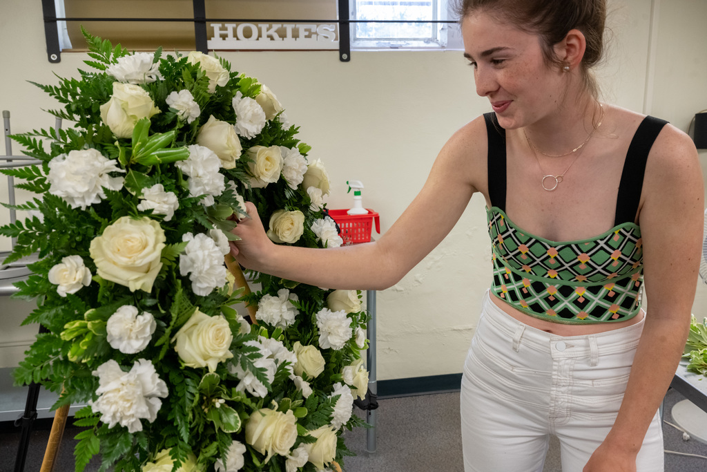 Creating floral arrangements for the April 16 Memorial