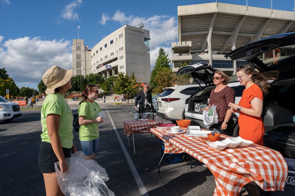 Volunteers help tackle sustainability at home football games