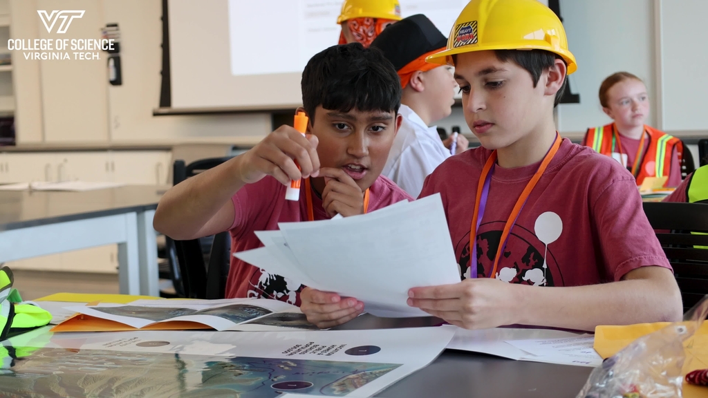 Geosciences campers roleplay a volcano disaster response