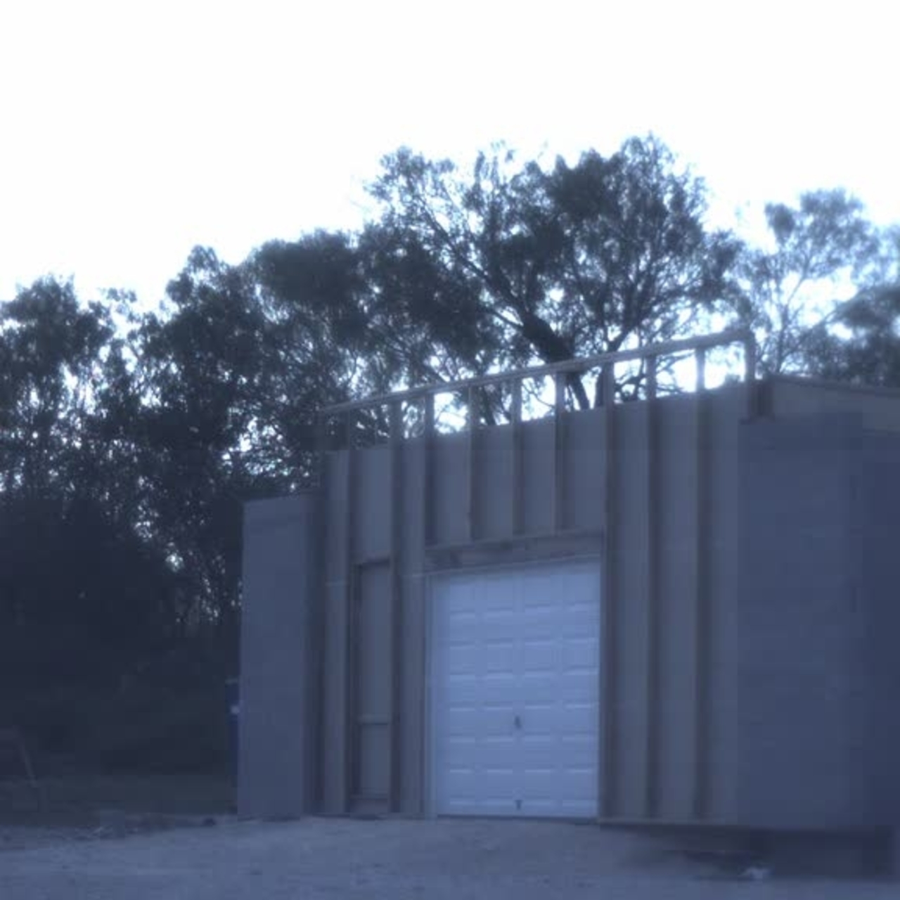 Test 7: Dispersion and Burning Behavior of Hydrogen Released in a Full-Scale Residential Garage in the Presence and Absence of Conventional Automobiles (View of garage exterior from high-speed camera)