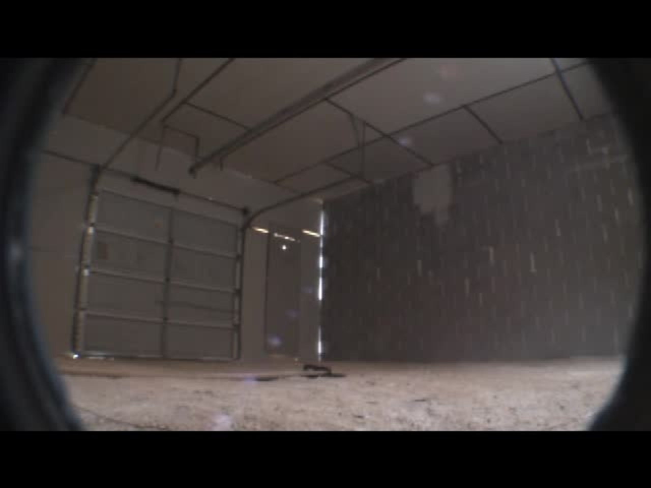 Test 13: Dispersion and Burning Behavior of Hydrogen Released in a Full-Scale Residential Garage in the Presence and Absence of Conventional Automobiles (View of garage interior from floor camera)