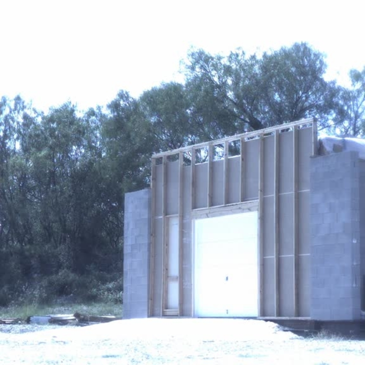 Test 3: Dispersion and Burning Behavior of Hydrogen Released in a Full-Scale Residential Garage in the Presence and Absence of Conventional Automobiles (View of garage exterior from high-speed camera)