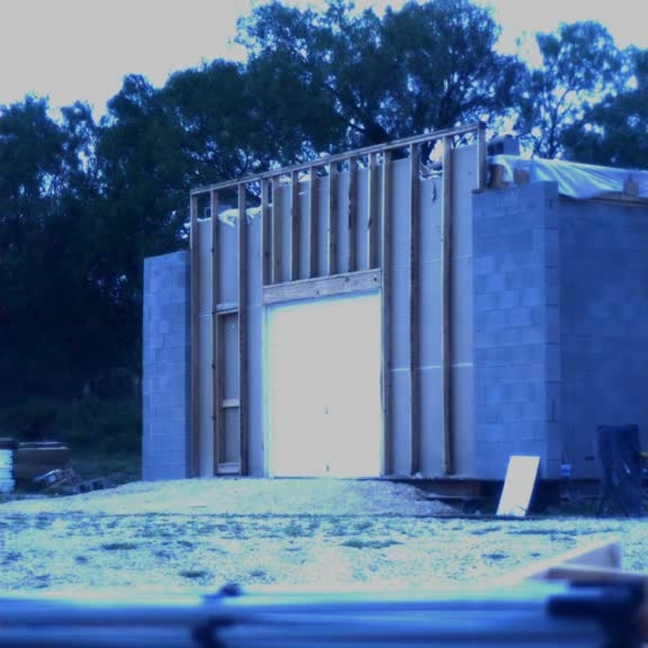 Test 12: Dispersion and Burning Behavior of Hydrogen Released in a Full-Scale Residential Garage in the Presence and Absence of Conventional Automobiles (View of garage exterior from high-speed camera)