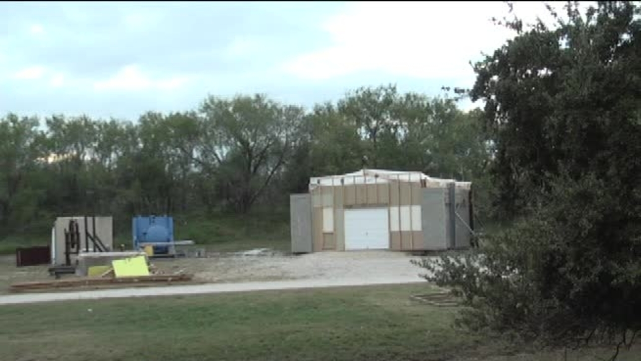 Test 8: Dispersion and Burning Behavior of Hydrogen Released in a Full-Scale Residential Garage in the Presence and Absence of Conventional Automobiles (View of garage exterior from HD camera sequence)