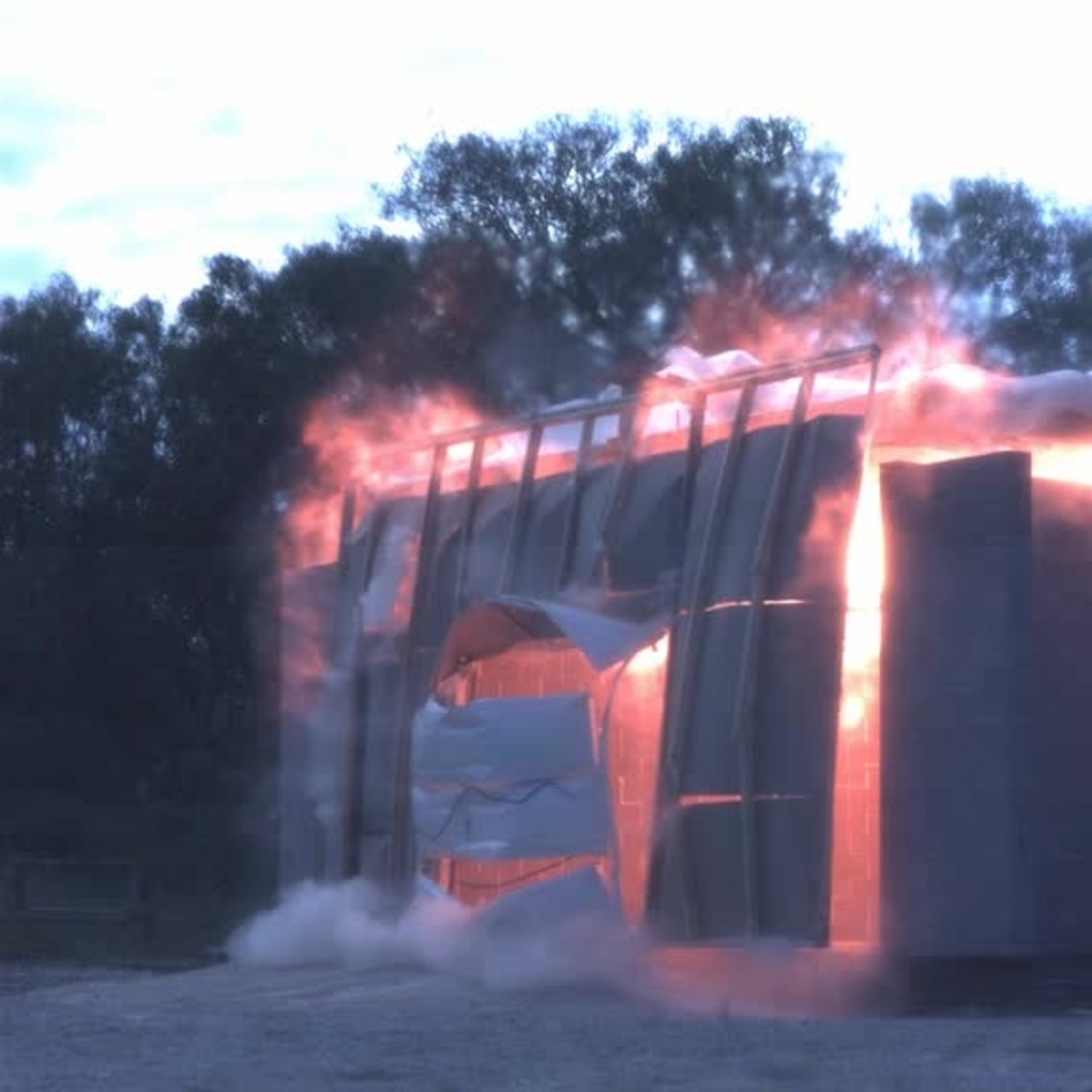 Test 4: Dispersion and Burning Behavior of Hydrogen Released in a Full-Scale Residential Garage in the Presence and Absence of Conventional Automobiles (View of garage exterior from high-speed camera)