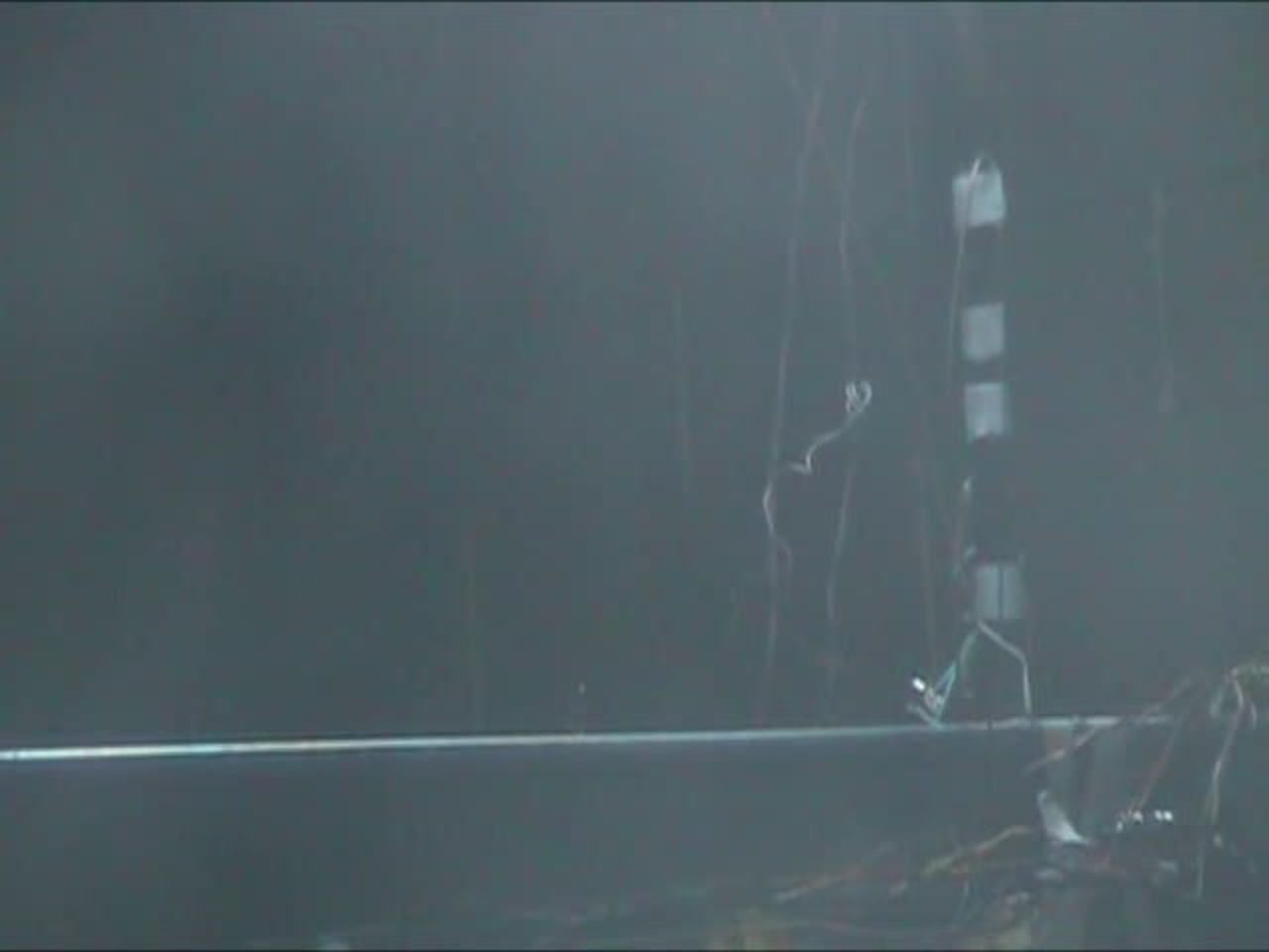 Test 10: Dispersion and Burning Behavior of Hydrogen Released in a Full-Scale Residential Garage in the Presence and Absence of Conventional Automobiles (View near ignition location and garage ceiling)