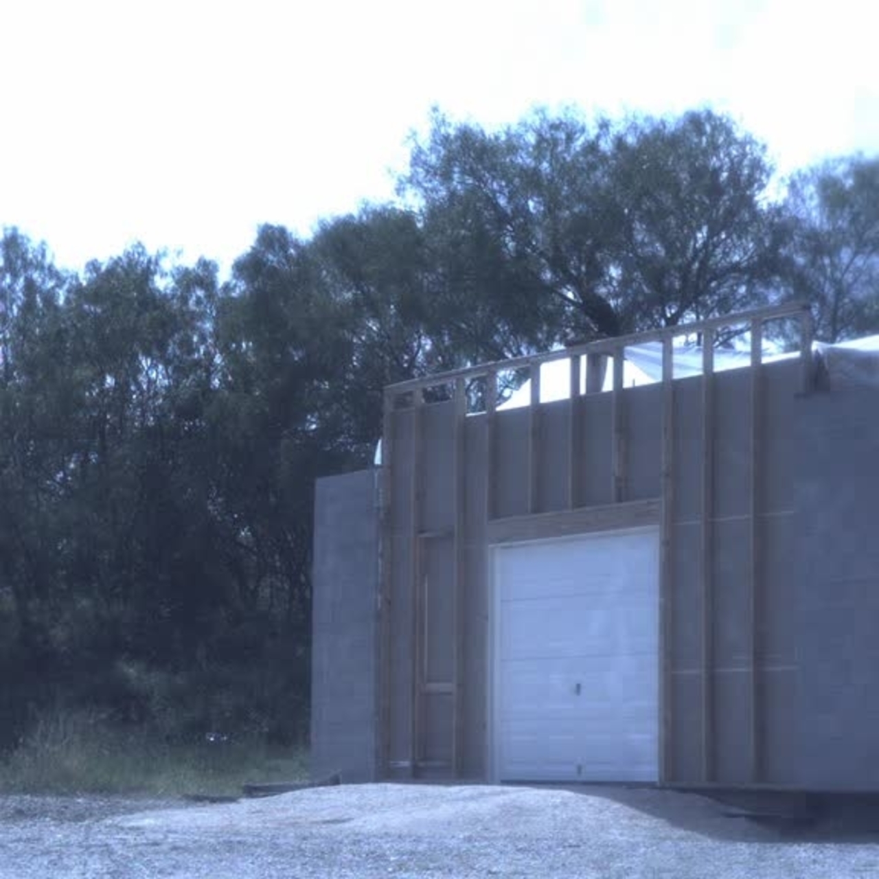 Test 11: Dispersion and Burning Behavior of Hydrogen Released in a Full-Scale Residential Garage in the Presence and Absence of Conventional Automobiles (View of garage exterior from high-speed camera)