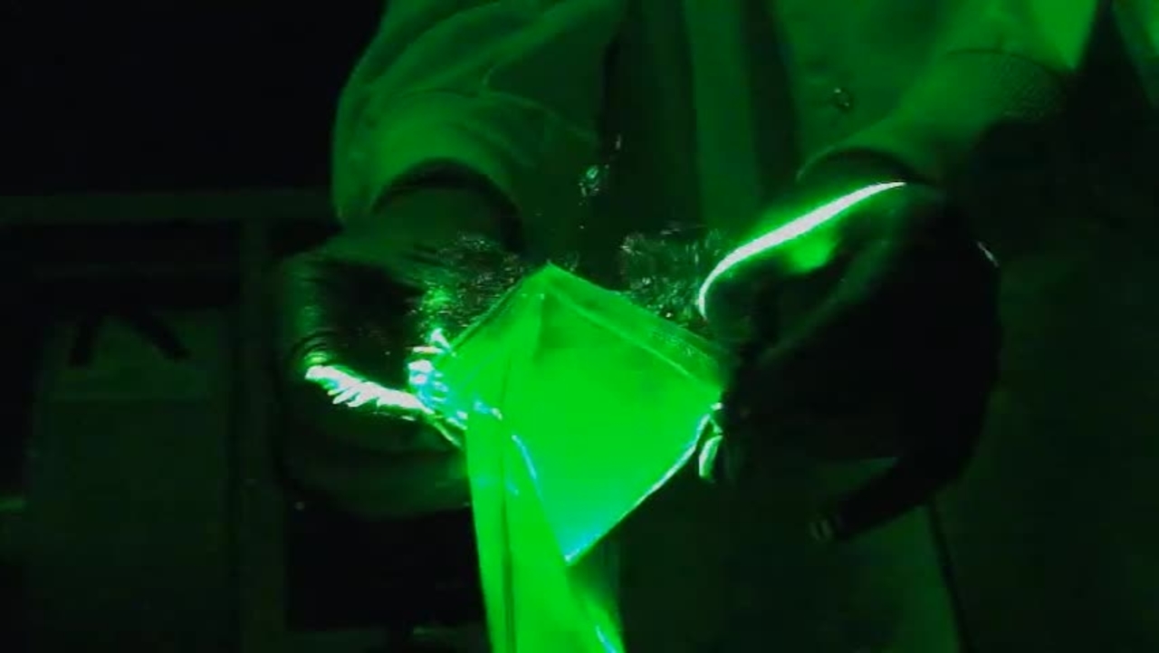 In Glowing Colors: Seeing the Spread of Drug Particles in a Forensic Lab